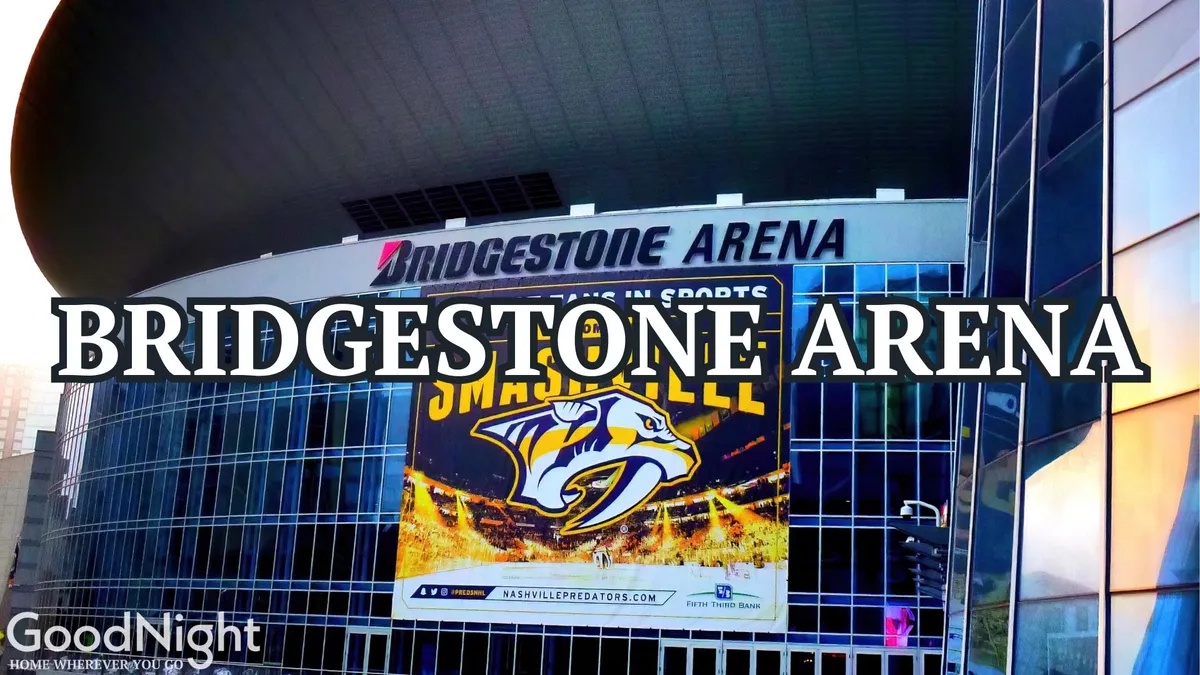 This exterior image captures the impressive facade of Bridgestone Arena, complete with the Nashville Predators logo and vibrant signage. The setting is bustling, reflecting energy and excitement typical of downtown Nashville's event scene.