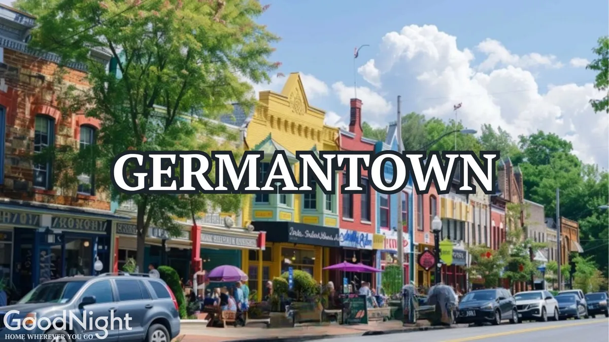 A lively downtown street scene with colorful storefronts, people dining outdoors, and lush trees lining the walkway. The image exudes energy, community, and easy walkability—core to the section’s message about convenience and local exploration.